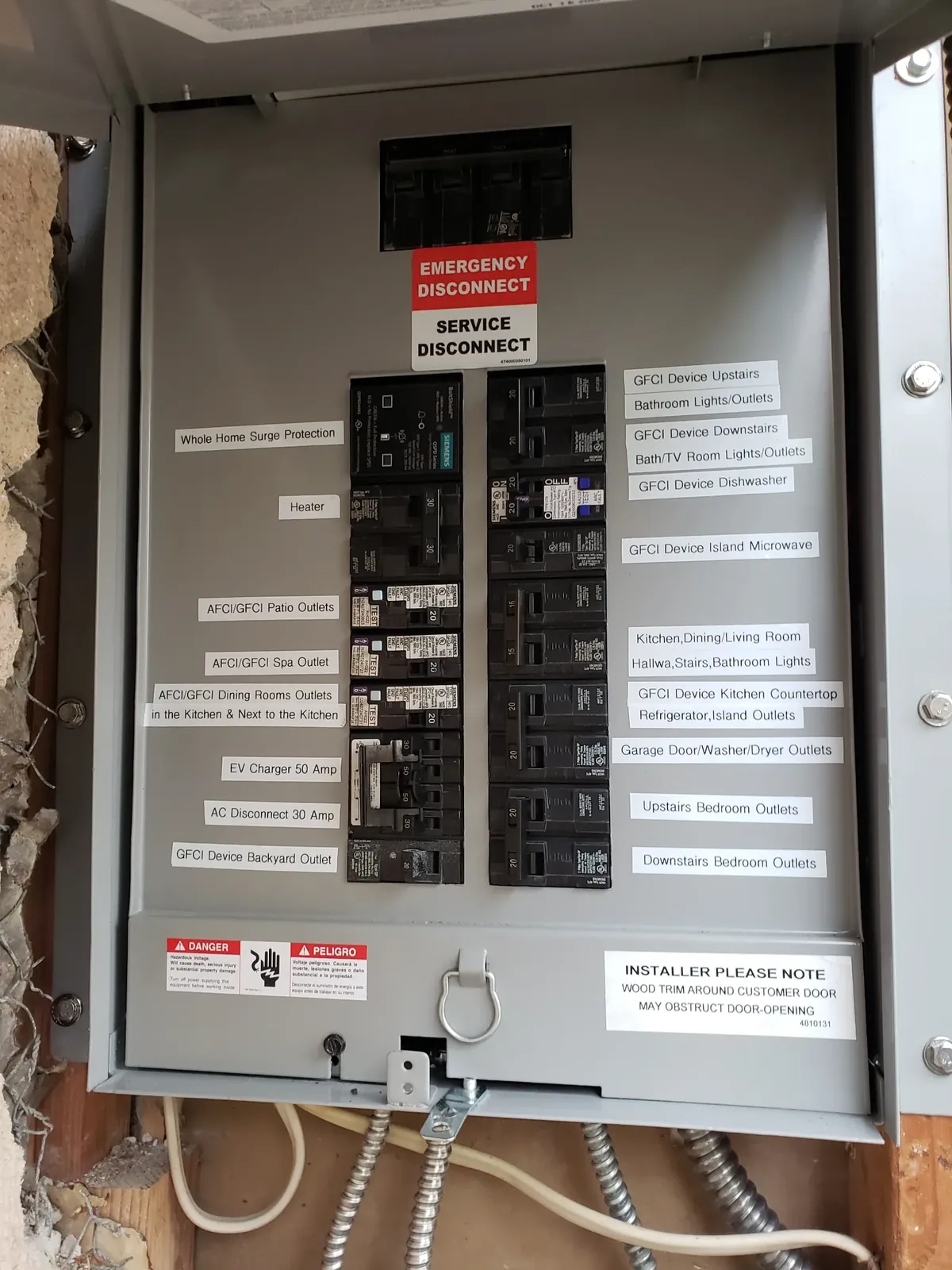 Upgraded electrical panel with labeled breakers, surge protection and EV charger circuit